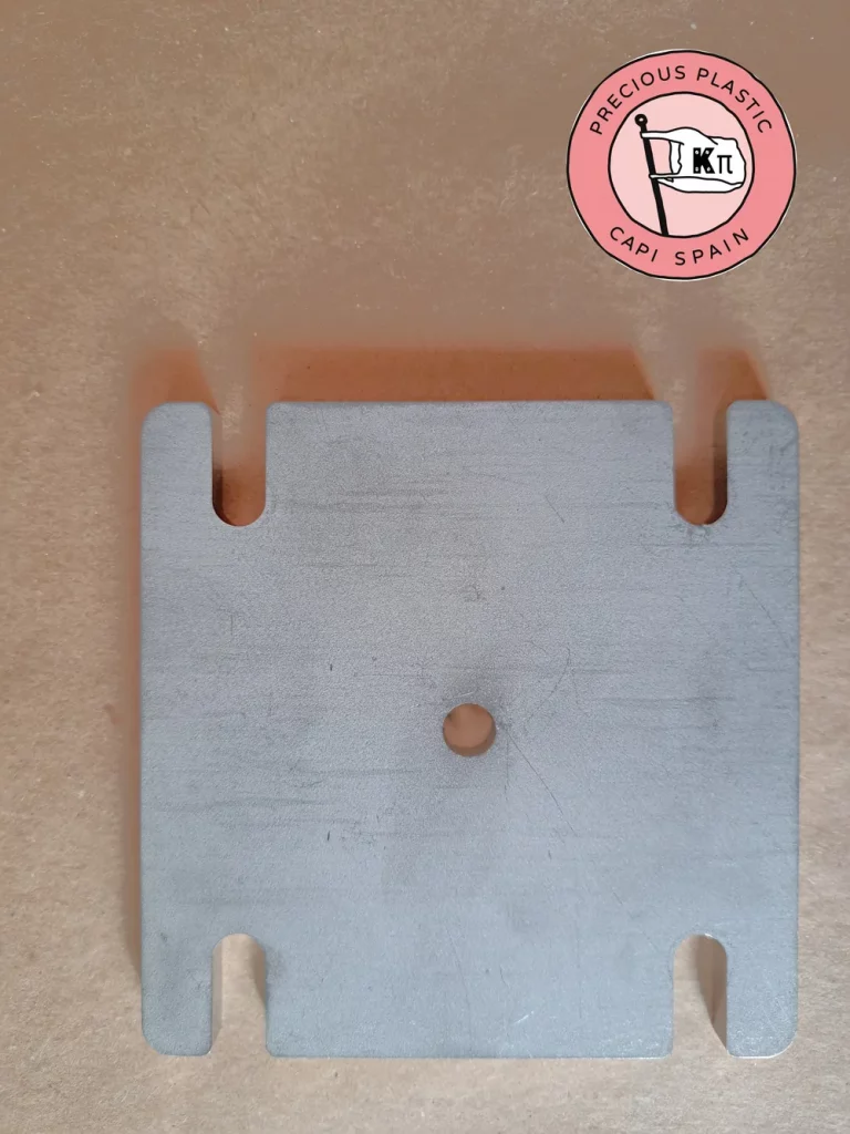 Stainless steel mini injection mould plate with the plastic inlet, from Precious Plastic Capi Spain's Mini Injection Moulds Series.