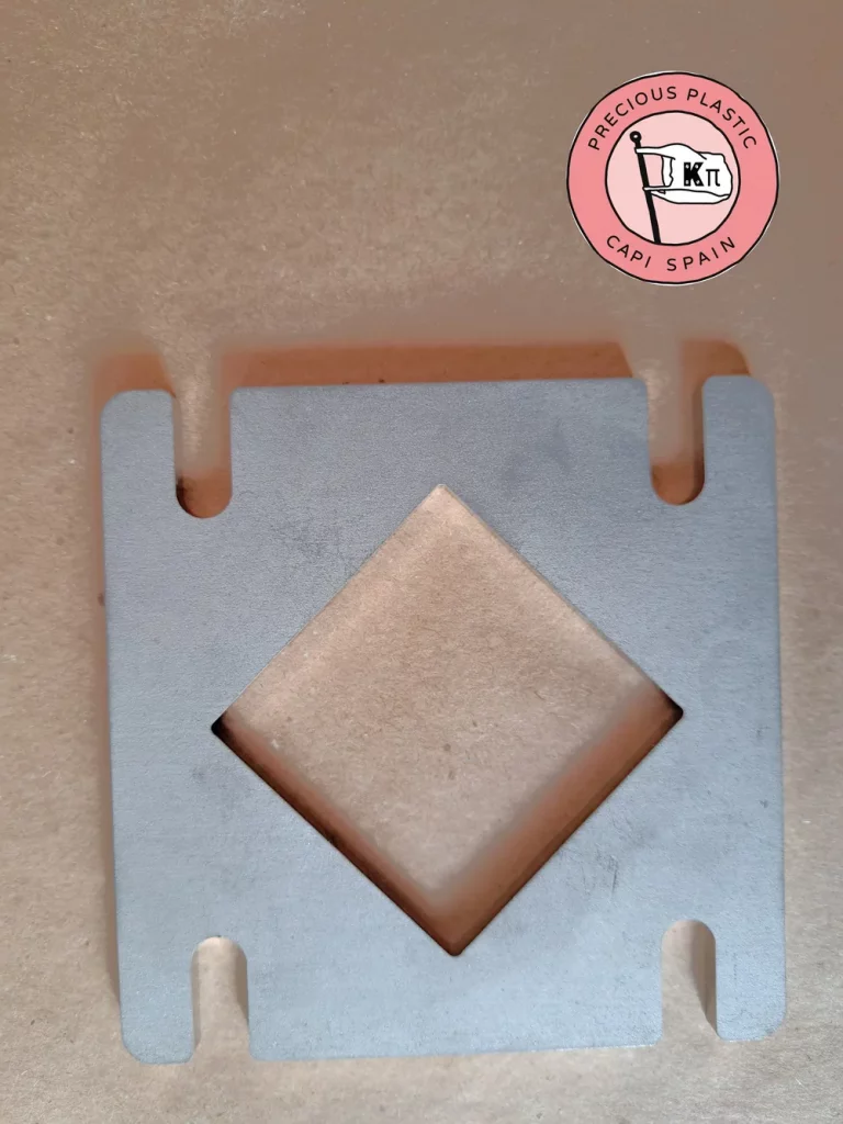 Stainless steel mini injection mould plate with a square shape, from Precious Plastic Capi Spain's Mini Injection Moulds Series.