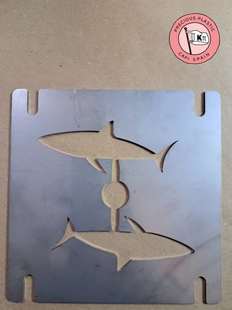 Stainless‑steel injection mould plate featuring two sharks, part of the Marine World Collection by Precious Plastic Capi Spain.