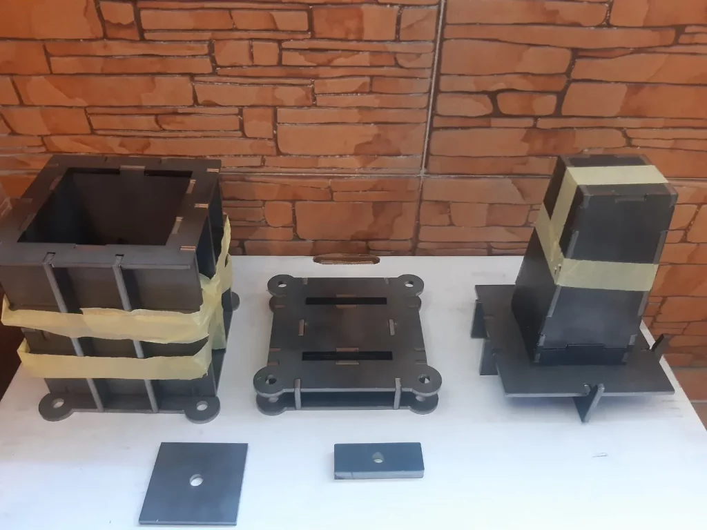 Set of modular metal mould parts for recycled plastic brick production, manufactured by Precious Plastic Capi Spain.