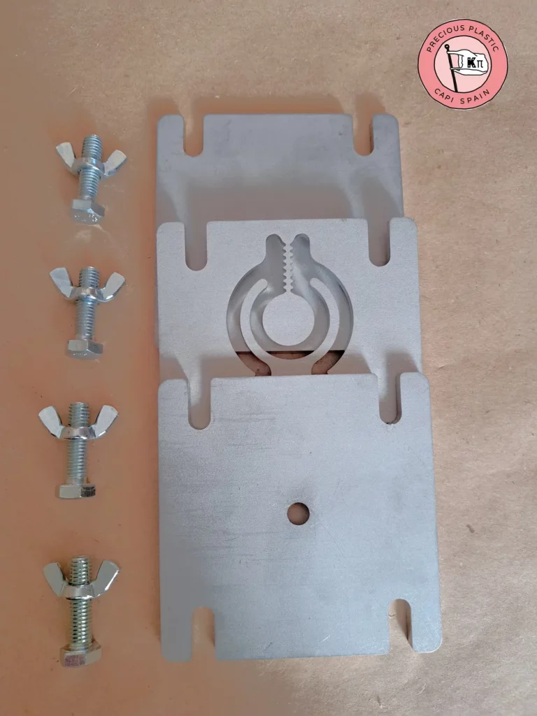 Technical exploded view of a modular mini injection mould with stainless steel plates, wing nut screws and a matrix with a piranha clip design.