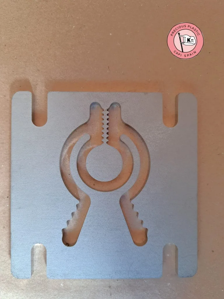 Stainless‑steel mini injection mould plate manufactured by Precious Plastic Capi Spain.