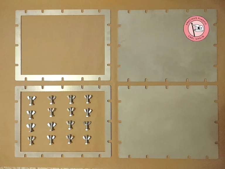 Set of stainless‑steel SheetPress mould plates and components manufactured by Precious Plastic Capi Spain.