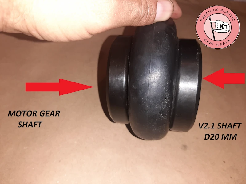 Flexible rubber coupling damper between the motor gear shaft and the twenty millimeter Precious Plastic shredder shaft.