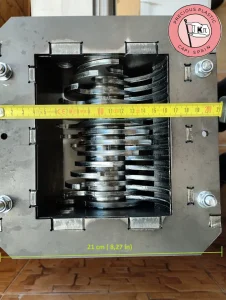 Measuring the 21 cm external hopper length of the assembled Precious Plastic V3.3 shredder box using a tape measure.